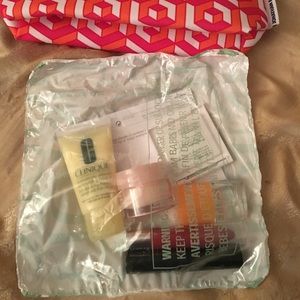 Brand new Clinique travel make up and bag